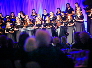 Photo of the choir performing at a concert